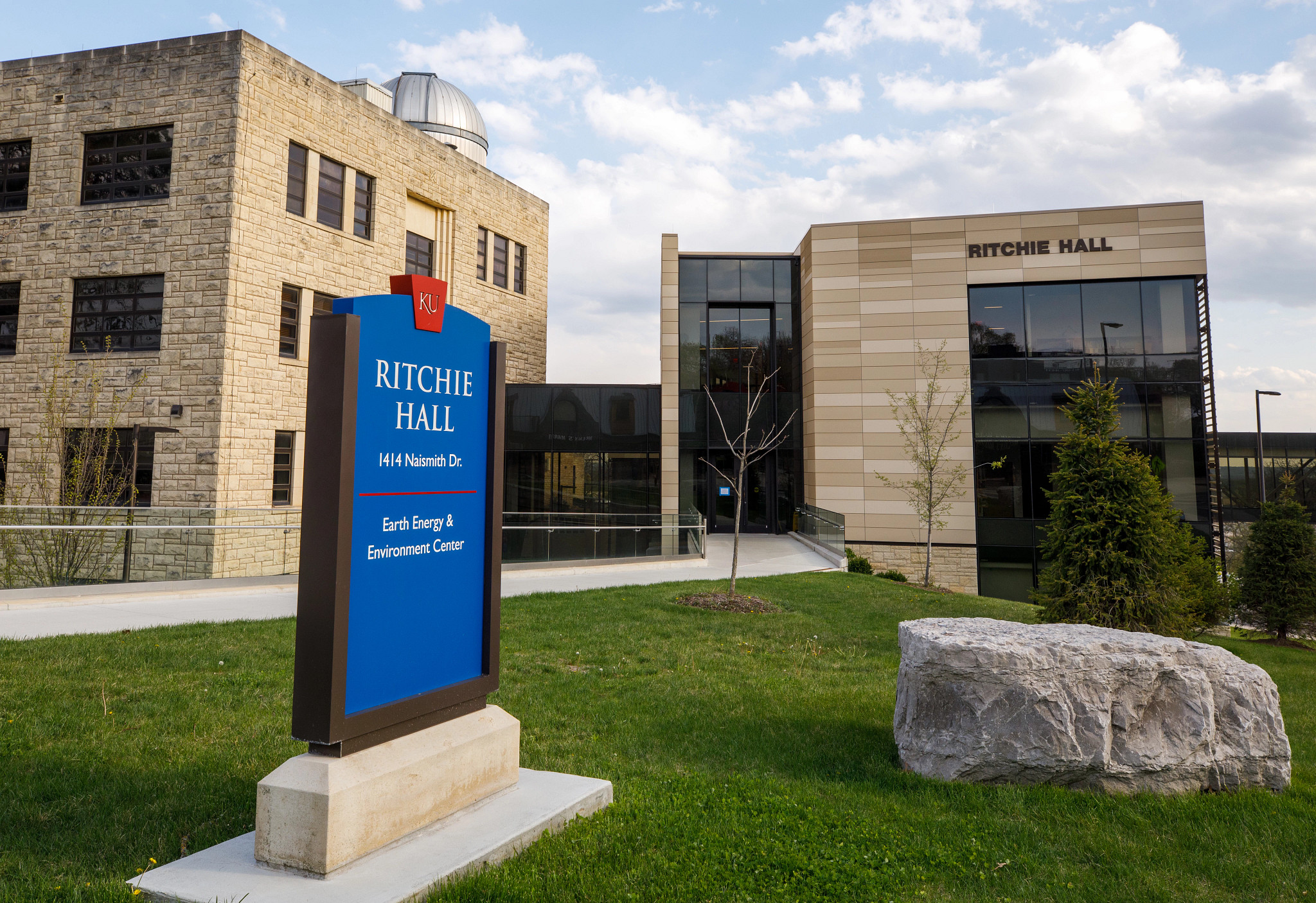 Earth, Energy, and Environment Center buildings on the KU Campus, with a rock and sign in front of the buildings